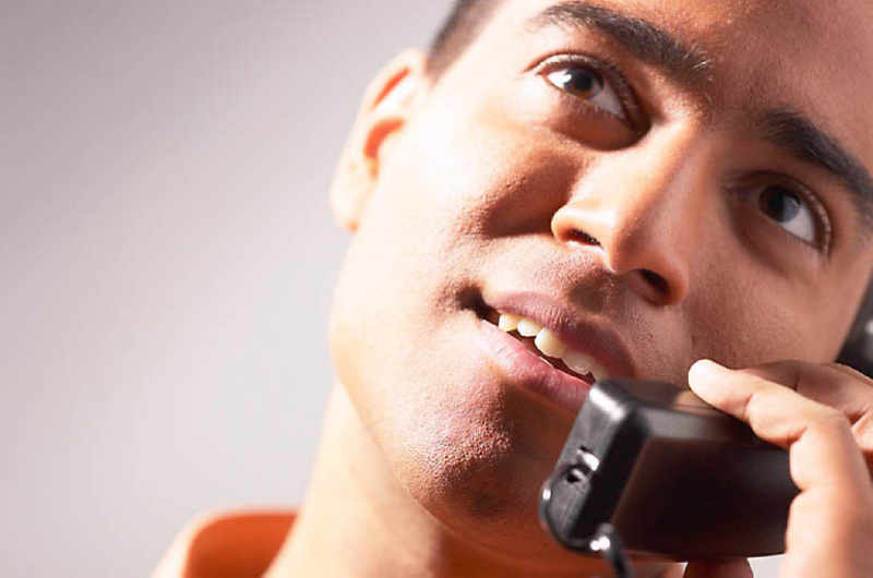 man talking on telephone